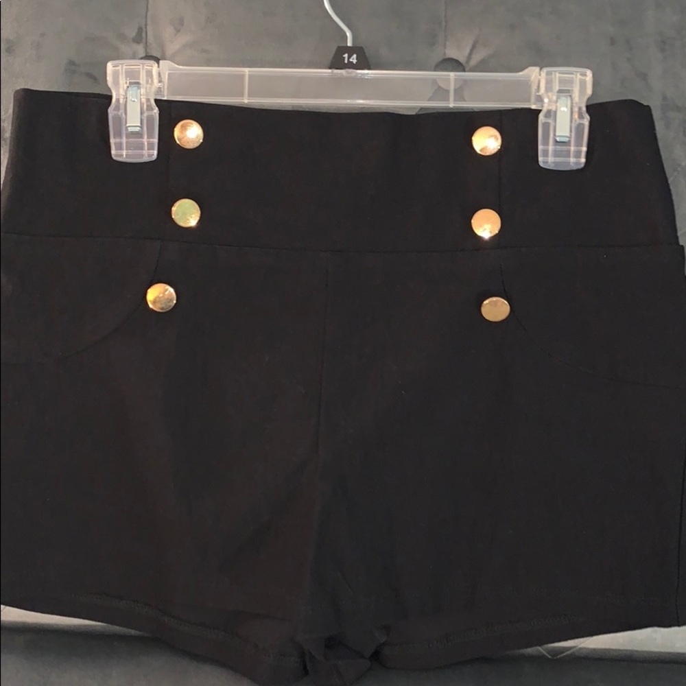 gold button detail black shorts